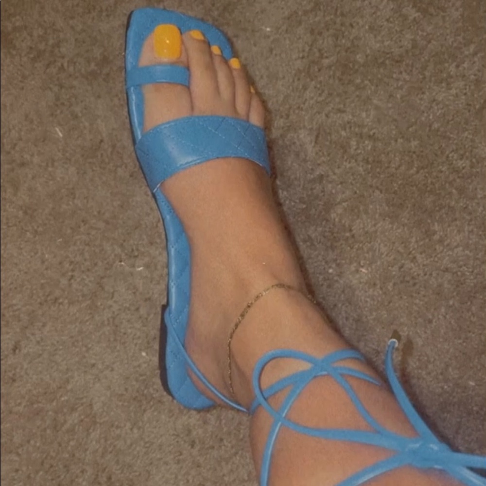 Baby blue strap up sandals.